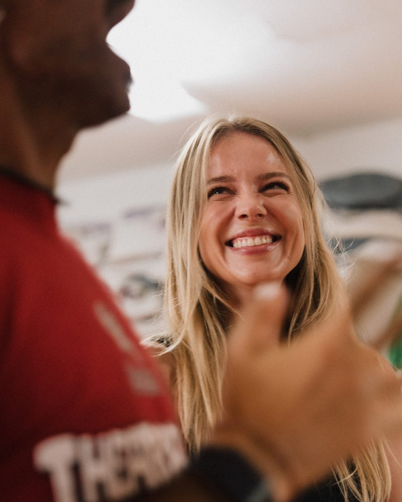 A participant laughing at someone just out of frame